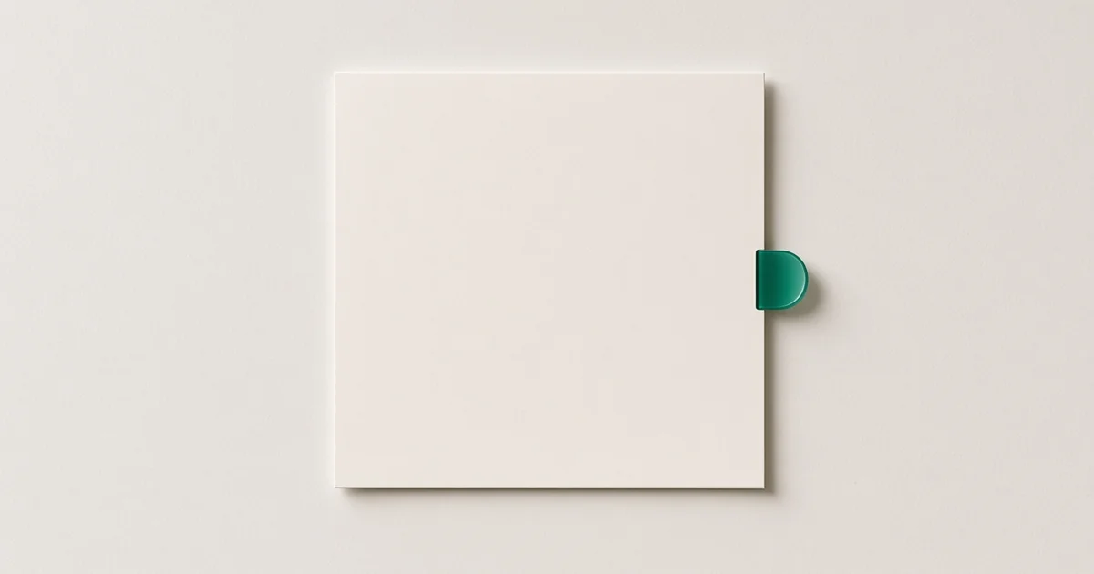 DV lottery photo: one 600 by 600 square One blank square print on a warm-white desk